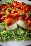 baked cod fillets covered with cherry tomato sauce over cauliflower spinach rice p2