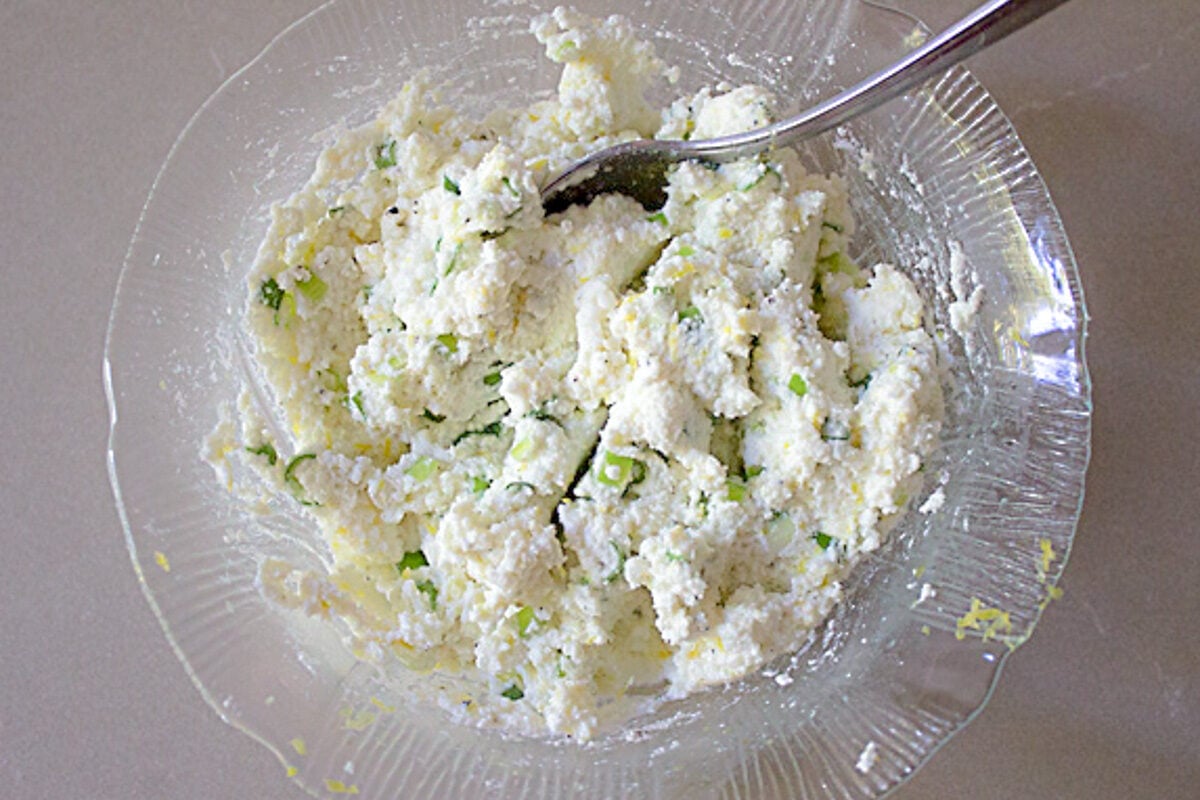 ricotta lemon green onion mixture in bowl.