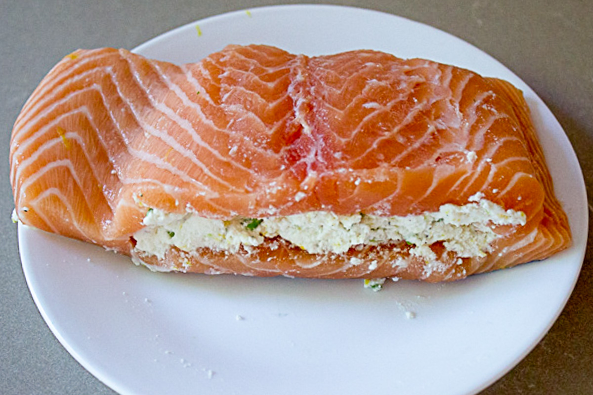 one raw salmon fillet stuffed with ricotta filling