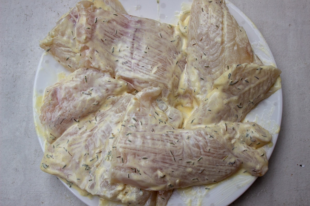 fish coated in seasoned mayonnaise