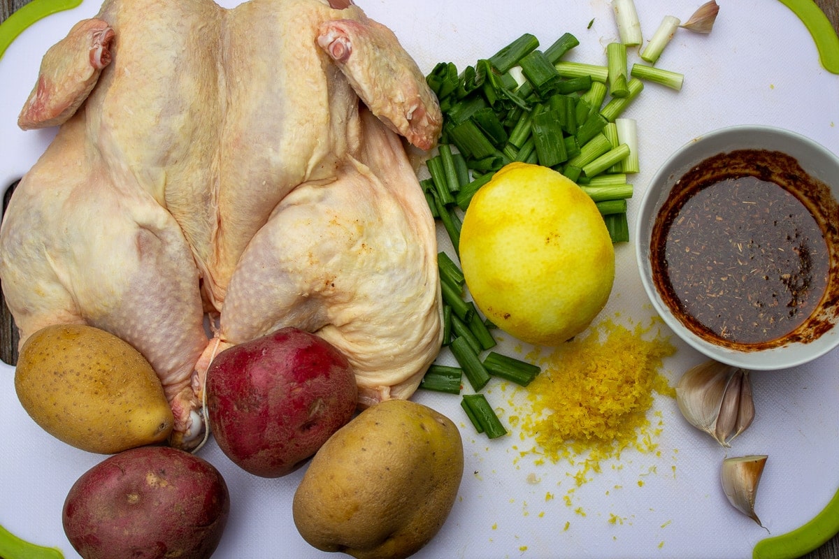 butterflied chicken, potatoes, lemon and zest, onions, seasoning