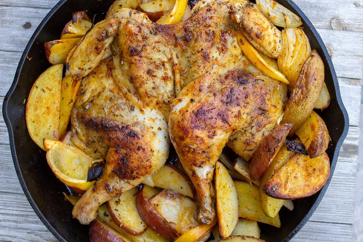 roasted chicken and potatoes in skillet 