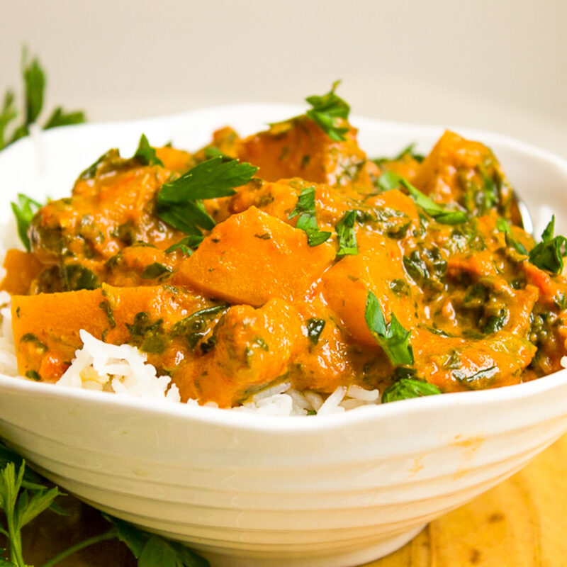squash curry over rice in bowl f