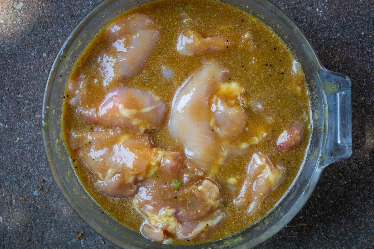 chicken marinating in bowl