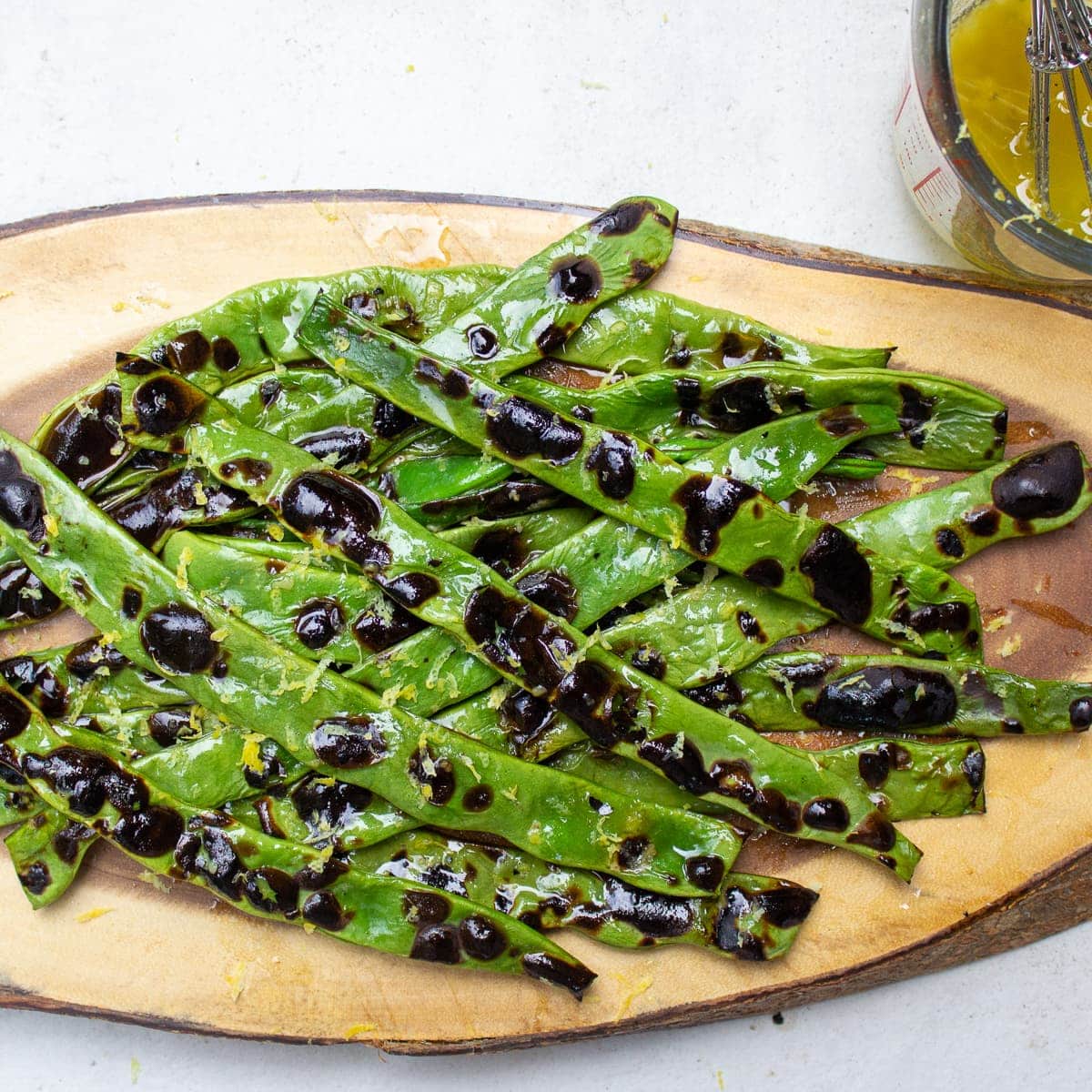 charred green beans on platter