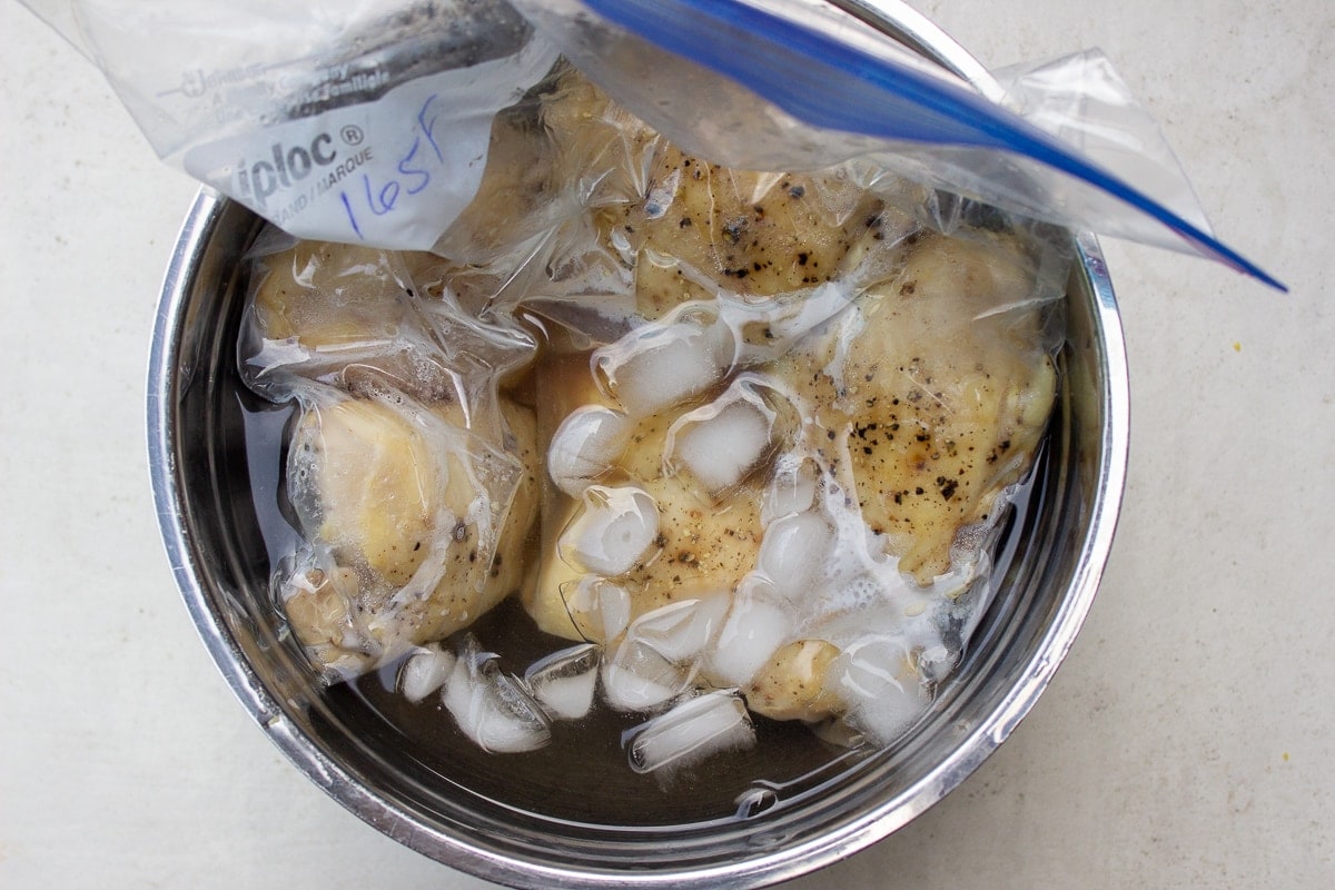 bagged sous vide thighs in ice water
