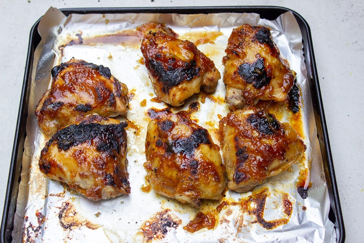 broiled chicken thighs on pan