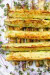 roasted zucchini spears on plate with microgreens-p