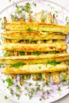 roasted zucchini spears on plate with microgreens-p2