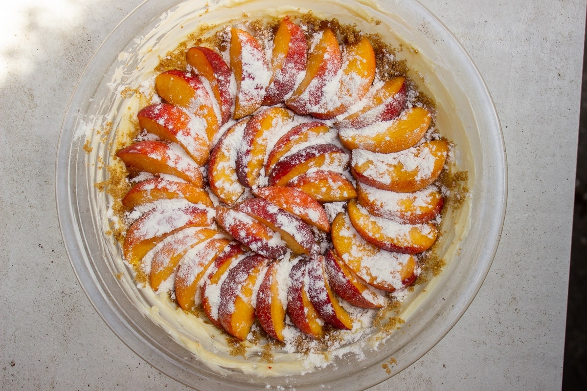 flour topping peaches in pie plate