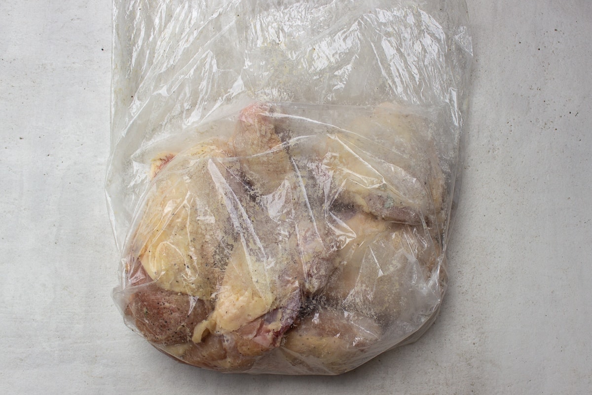 chicken with seasoned flour in bag
