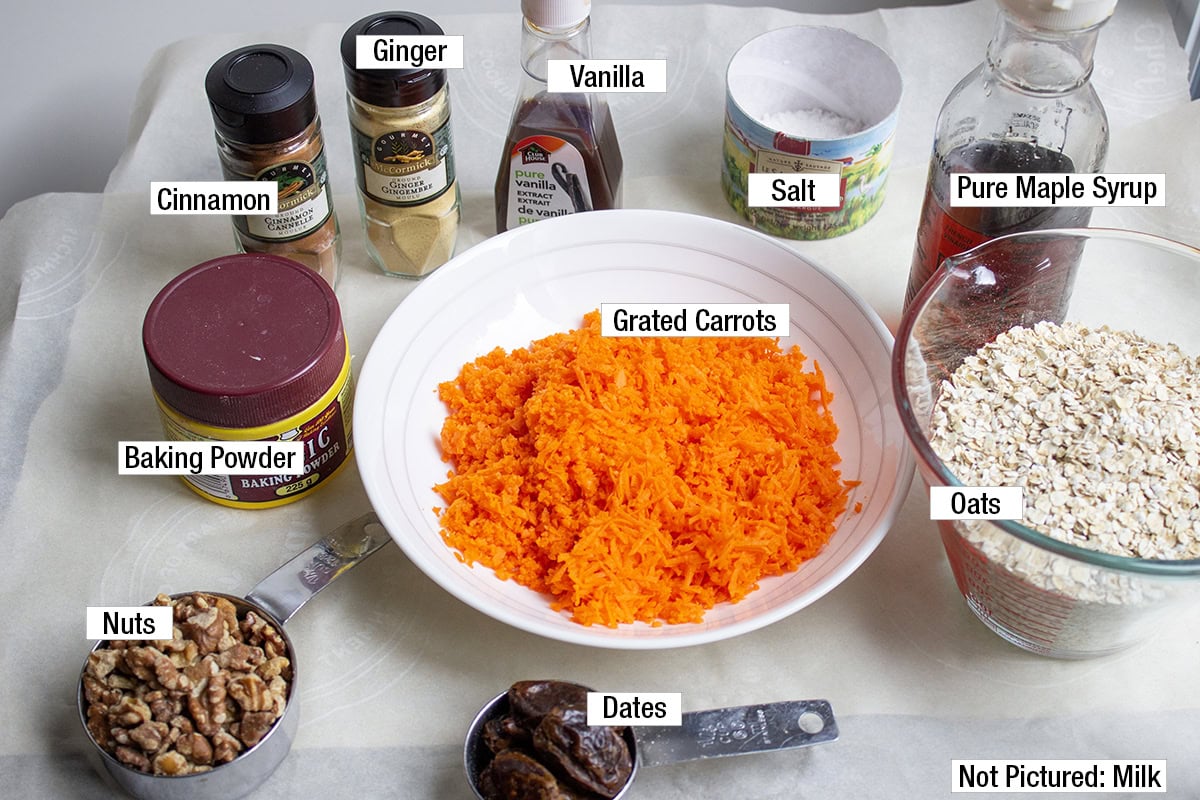 Grated carrots, baking powder, nuts, dates, oats, pure maple syrup, cinnamon, ginger, vanilla, salt (plus milk, not pictured).
