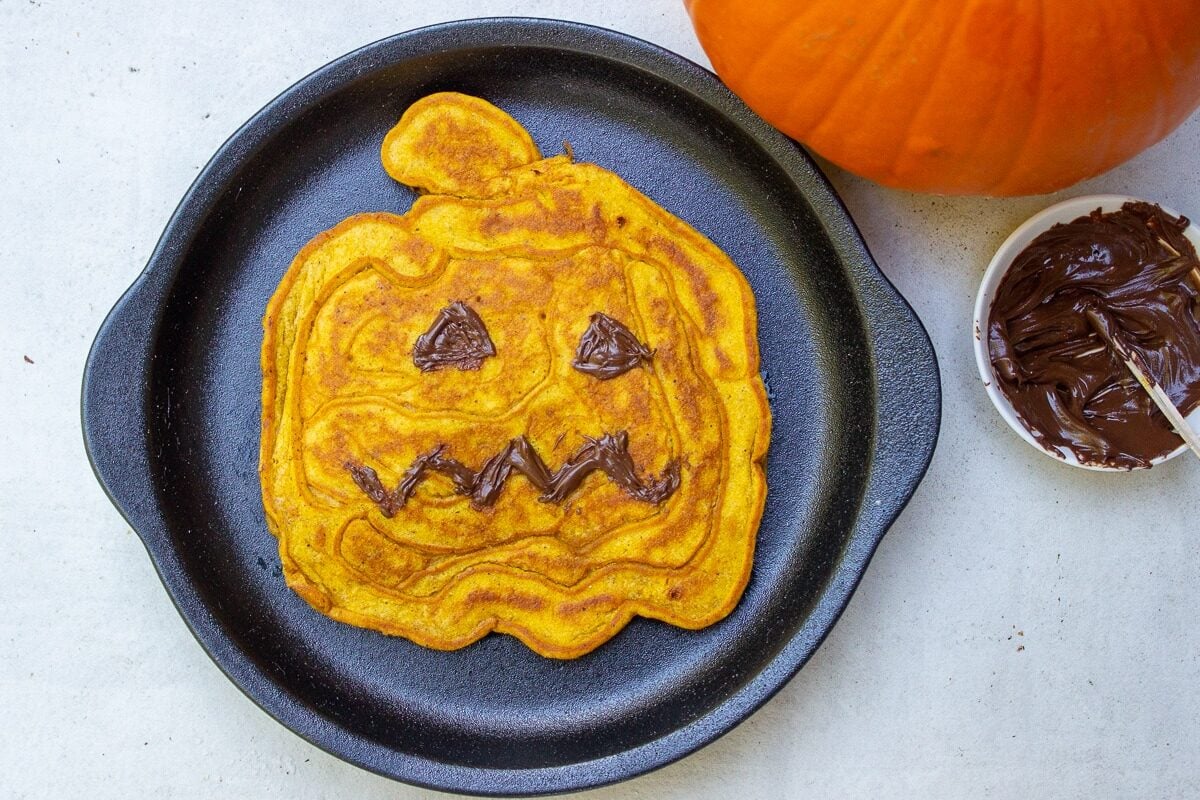 pumpkin face pancake on plate