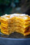 stack of pumpkin pancakes on plate cut open p