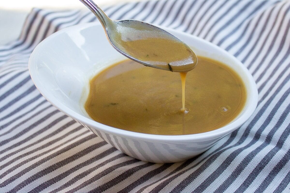 beef gravy in bowl with spoon p1