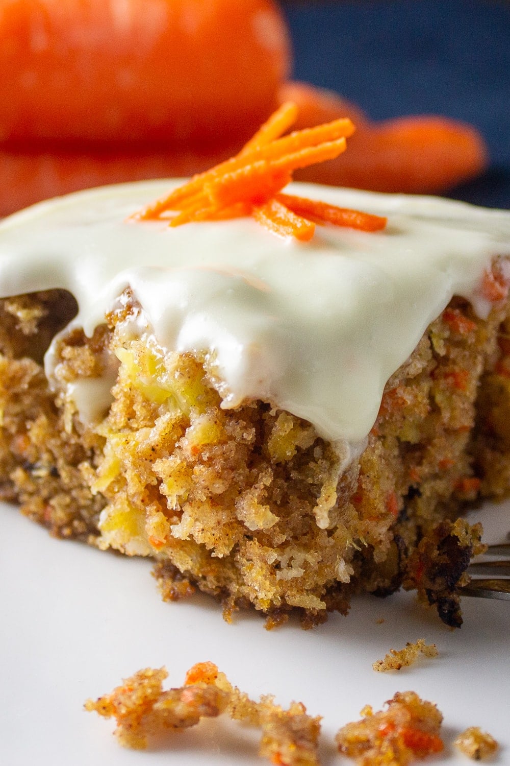 piece of carrot cake with pineapple on plate 