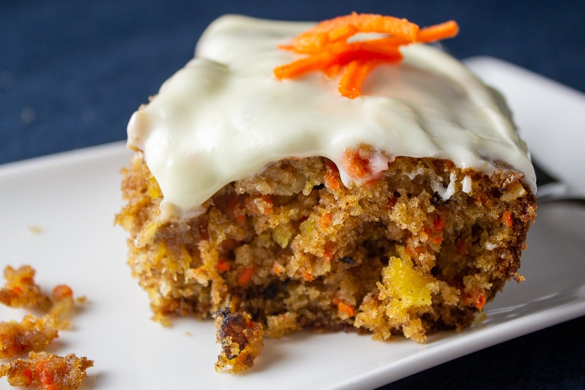 piece of carrot cake with pineapple on plate 3