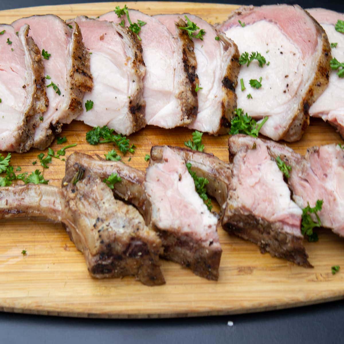pork rib roast sliced on cutting board