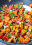 Sweet potato hash in skillet.
