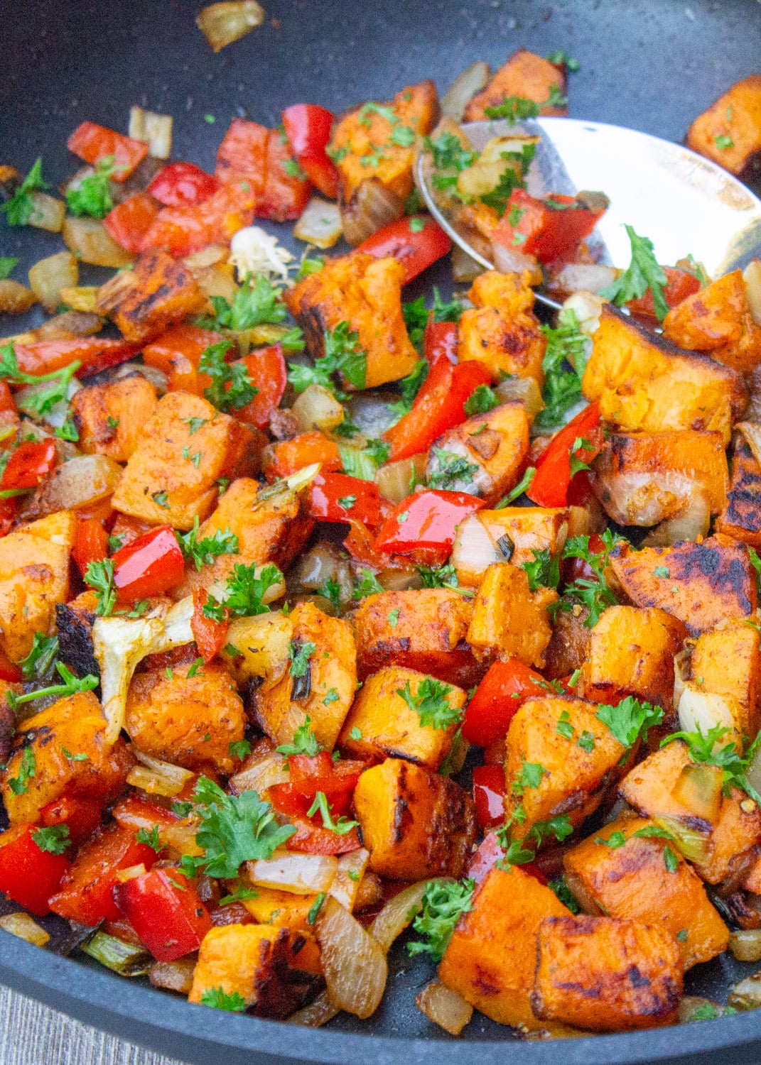 Sweet potato hash in skillet. 