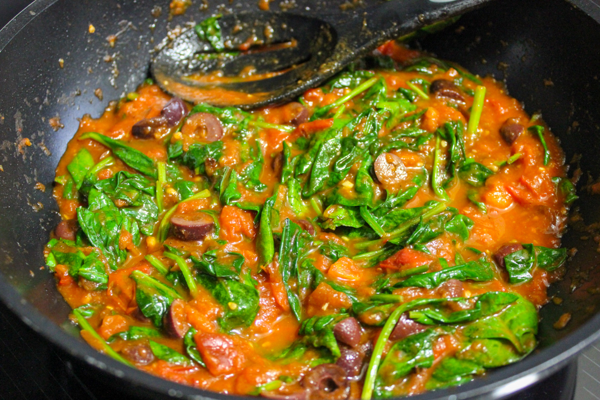 tomato spinach sauce in skillet