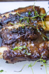 grilled beef ribs on cutting board p