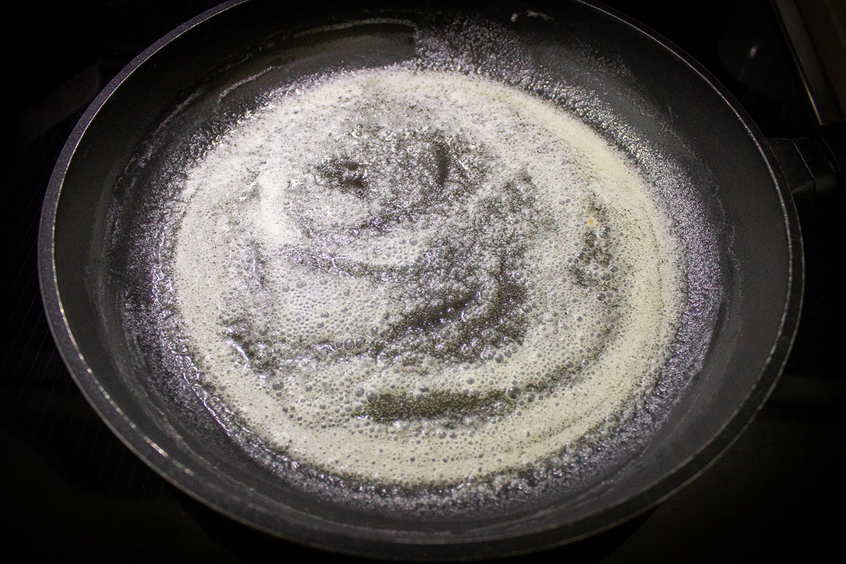 butter melting in cast iron skillet