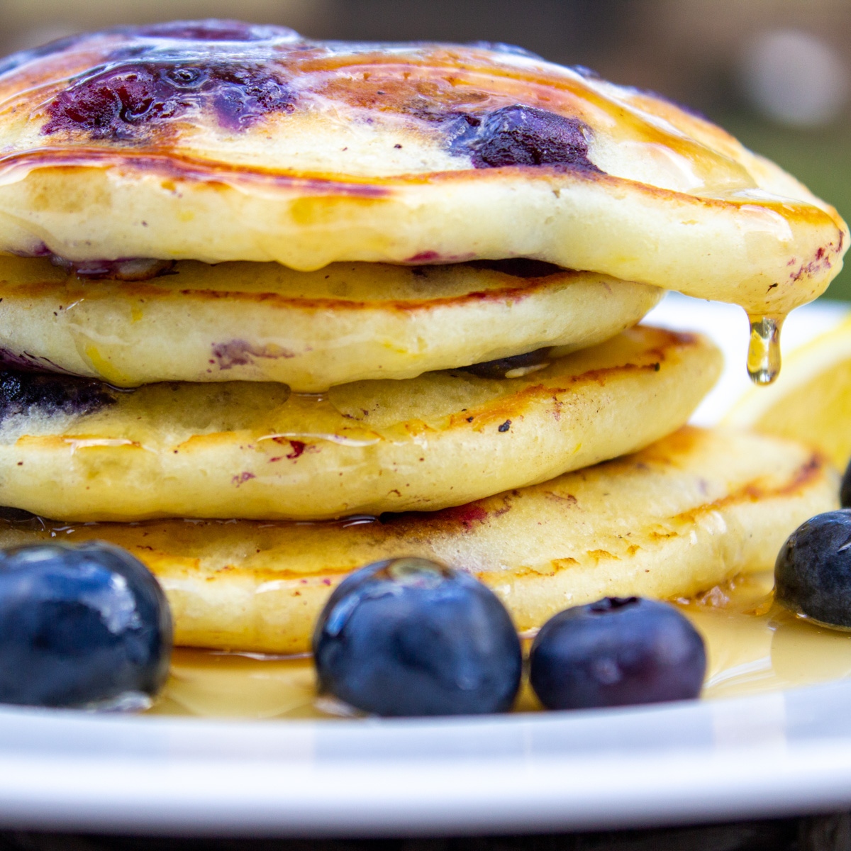 lemon blueberry pancake with syrup on plate