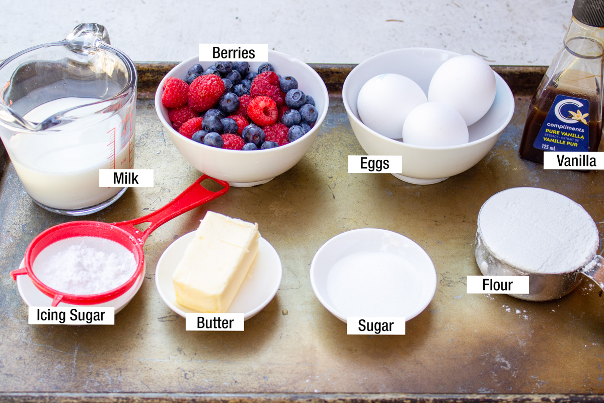 sugar, flour, eggs, butter, milk berries, vanilla, powdered sugar.