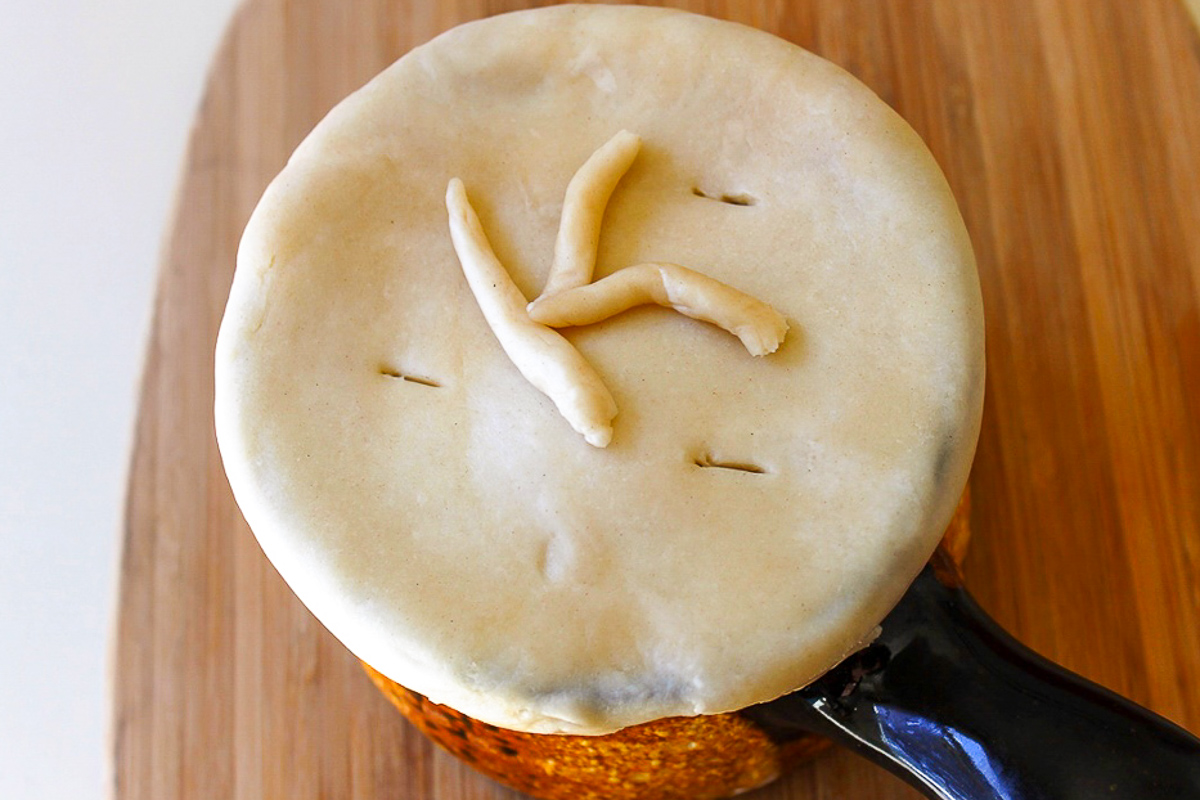 individual chicken pot pie with dough pie crust on top