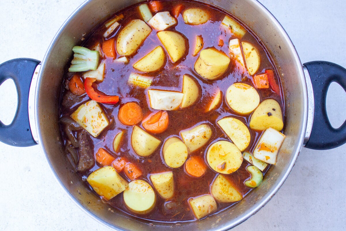 beef veggies and liquids on pot