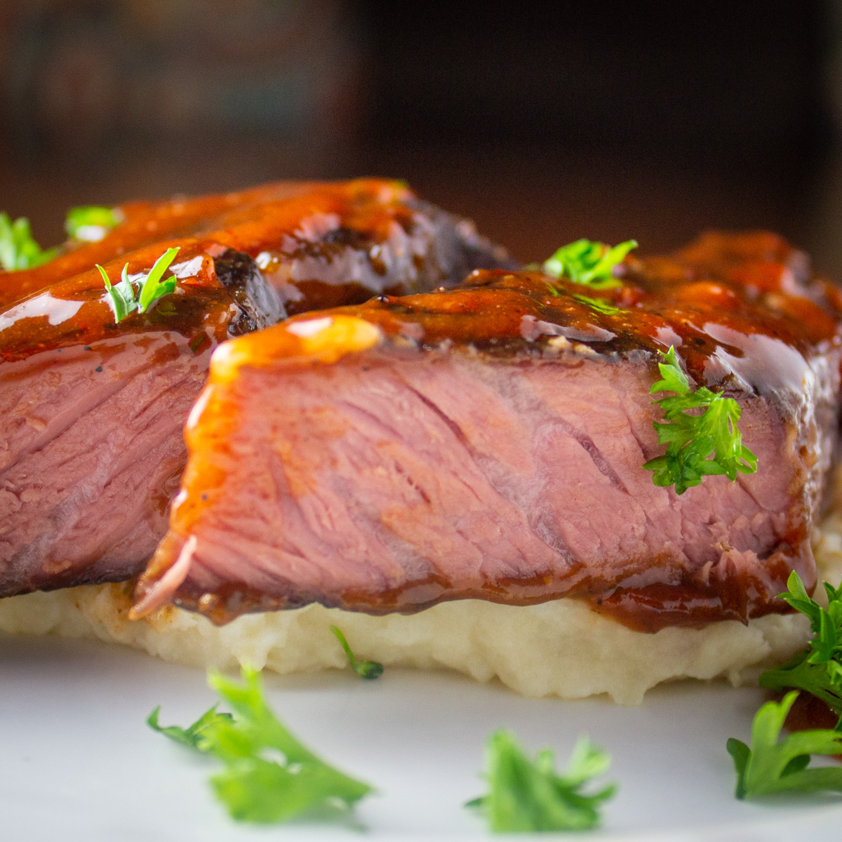 beef short ribs sliced over mashed potatoes