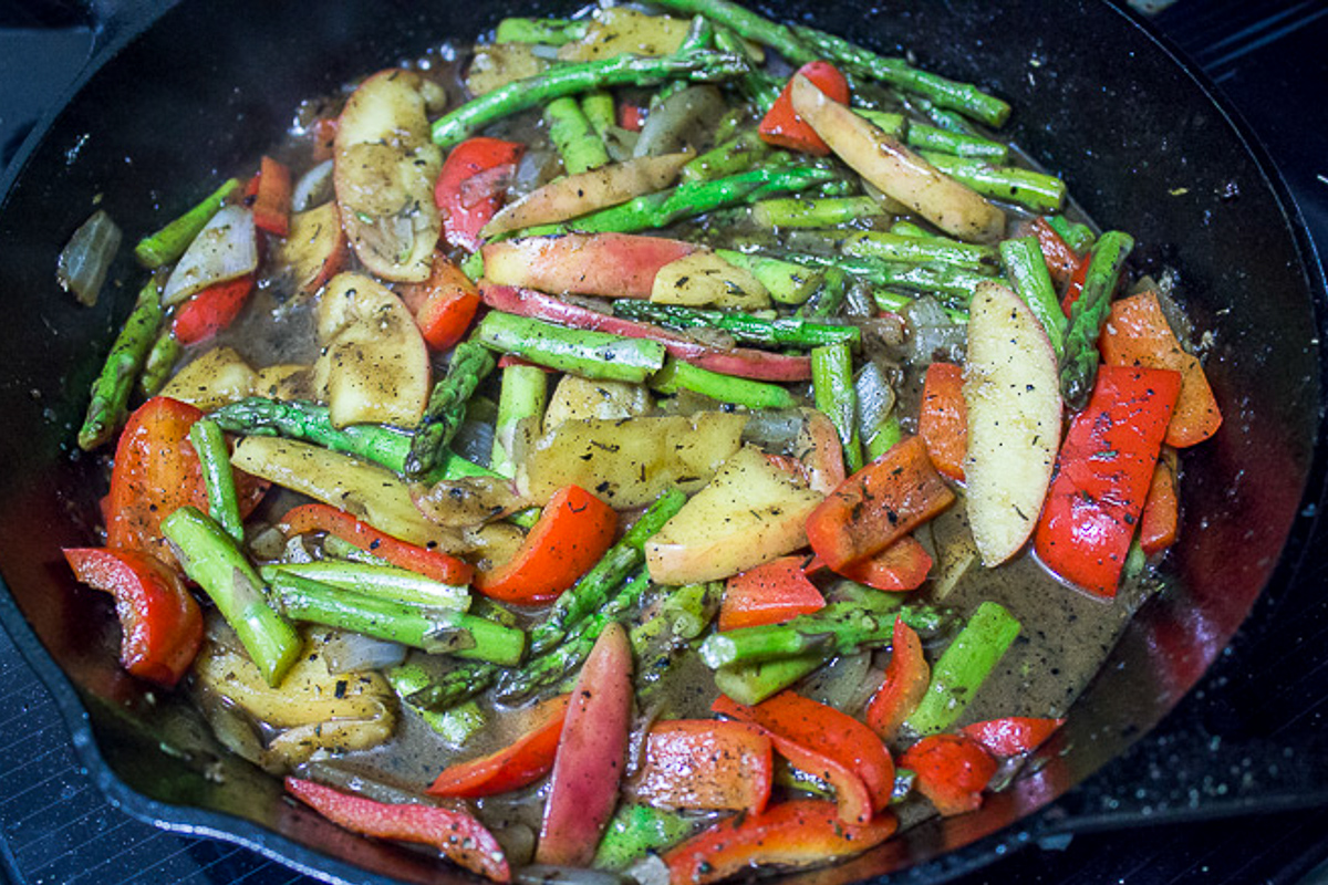 veggies and sauce in cast iron skillet