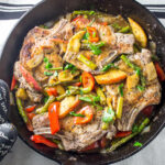 pork chops and veggies in skillet