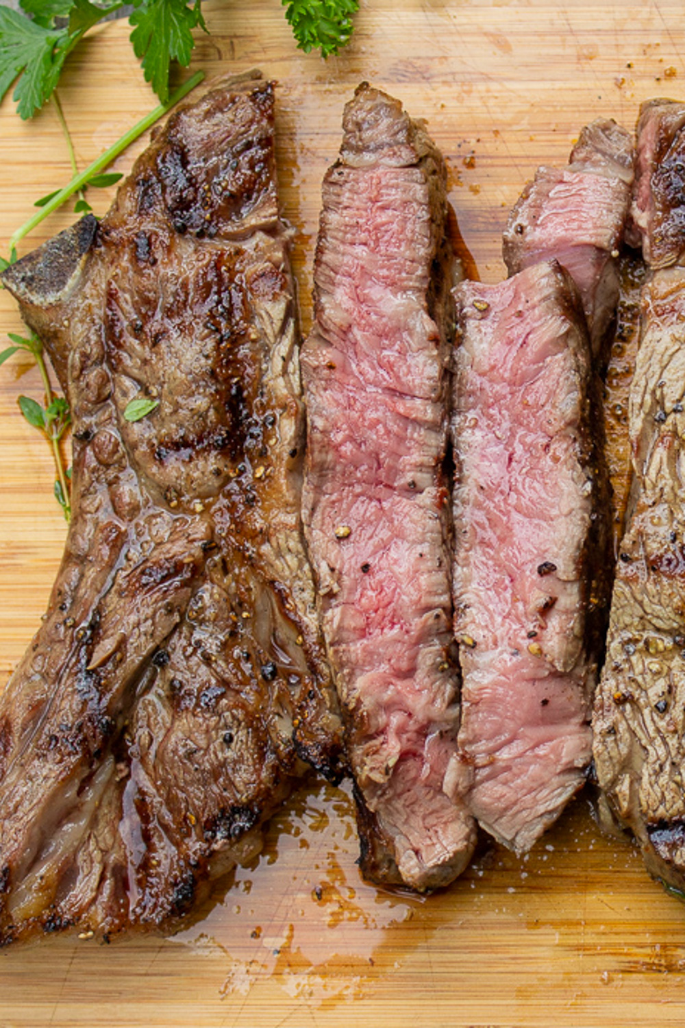 sliced rib steak on cutting board p