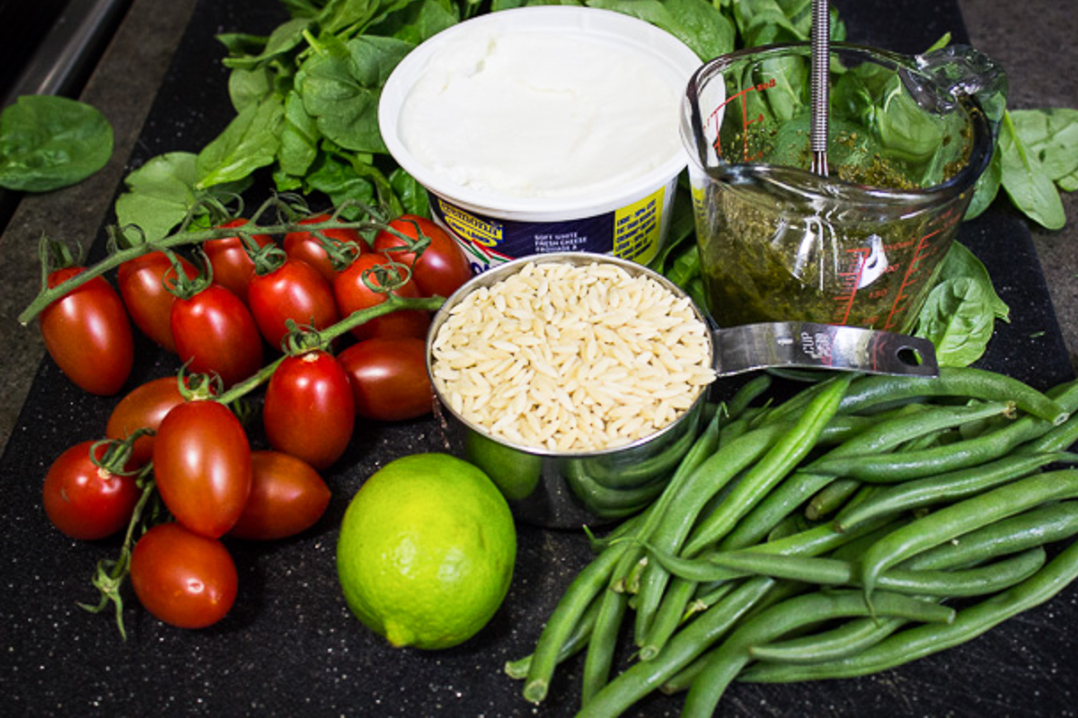 pesto, orzo, tomatoes, beans, spinach, lime, goat cheese