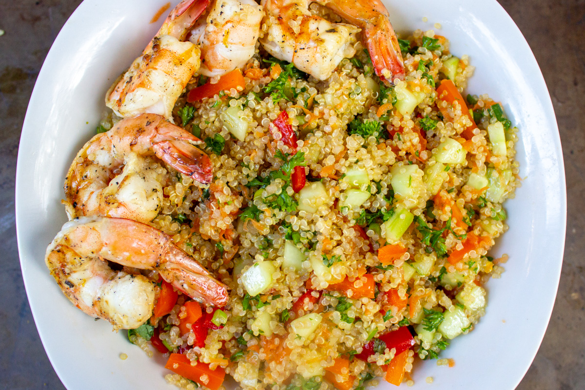 veggie quinoa in serving bowl with shrimp