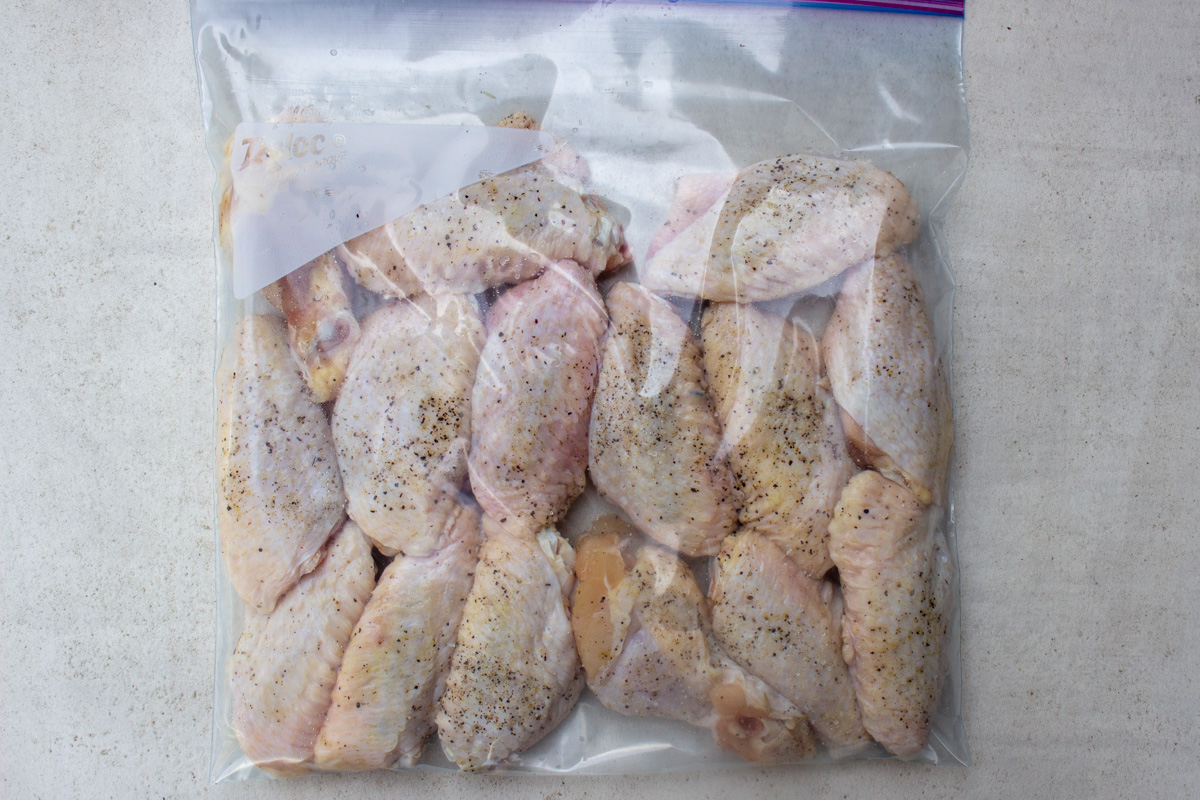 seasoned wings in plastic bag