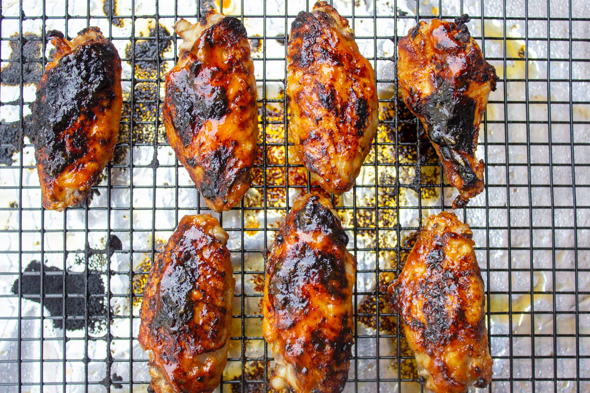 wings with sauce on grate after broiling