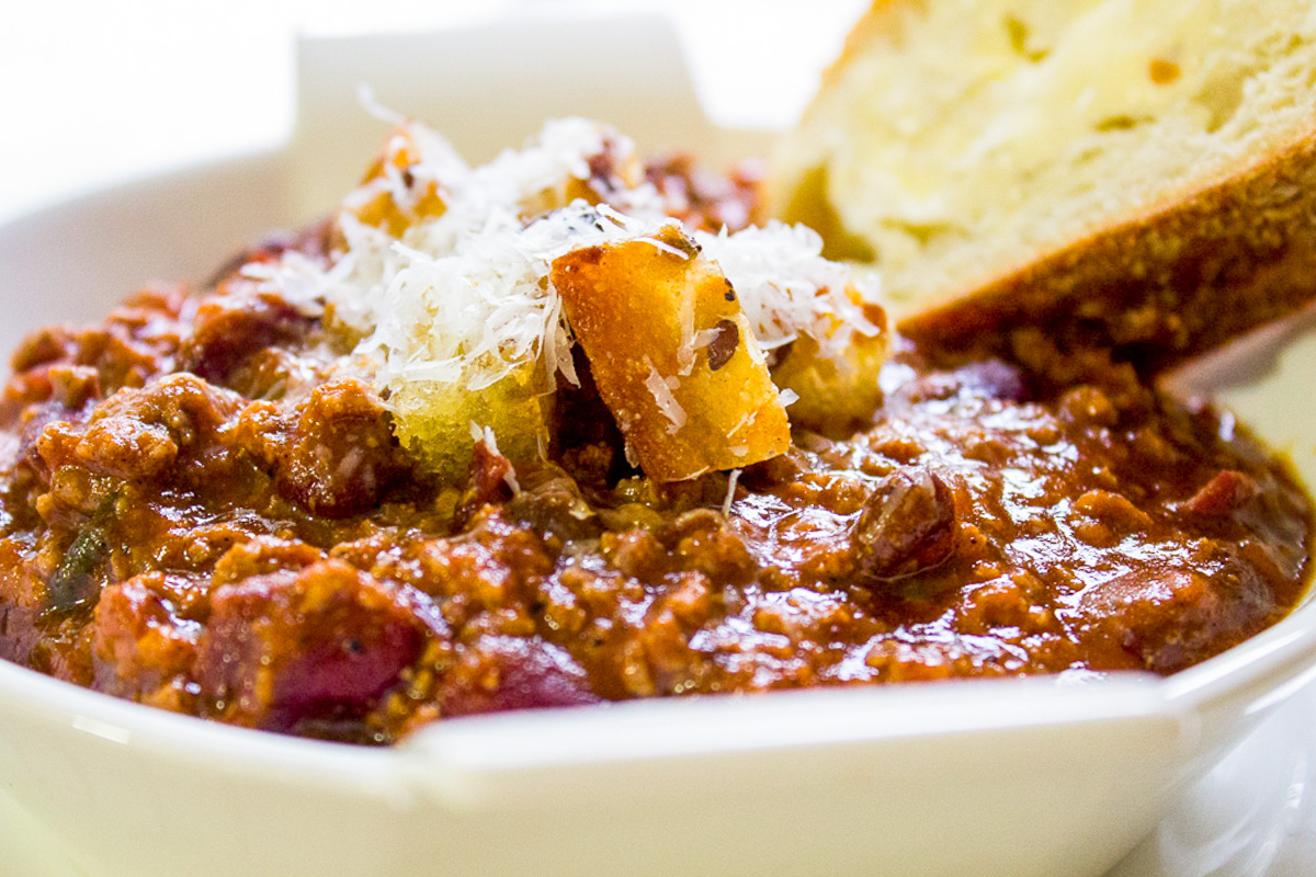 bowl of chili with bread and homemade croutons