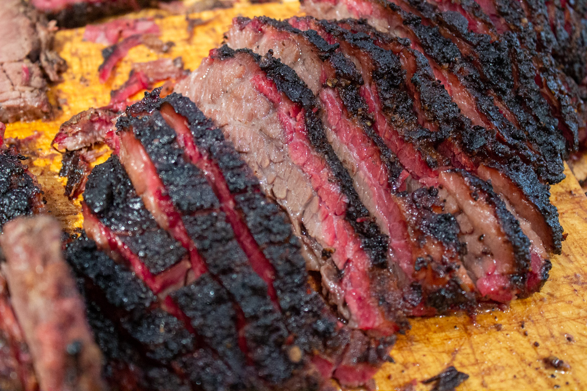 sliced point section of brisket showing smoke ring