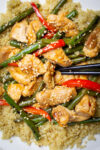 chicken and green bean stir fry in skillet with sesame seeds p1