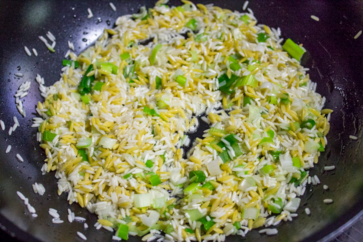 rice and orzo with herbs sauteed in pan