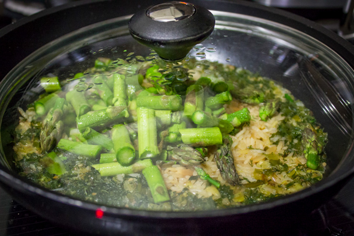 covered skillet with rice a roni and asparagus