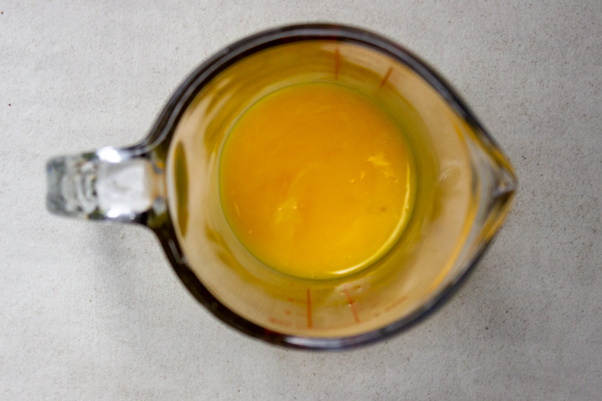 lightly beaten egg yolks in measuring cup