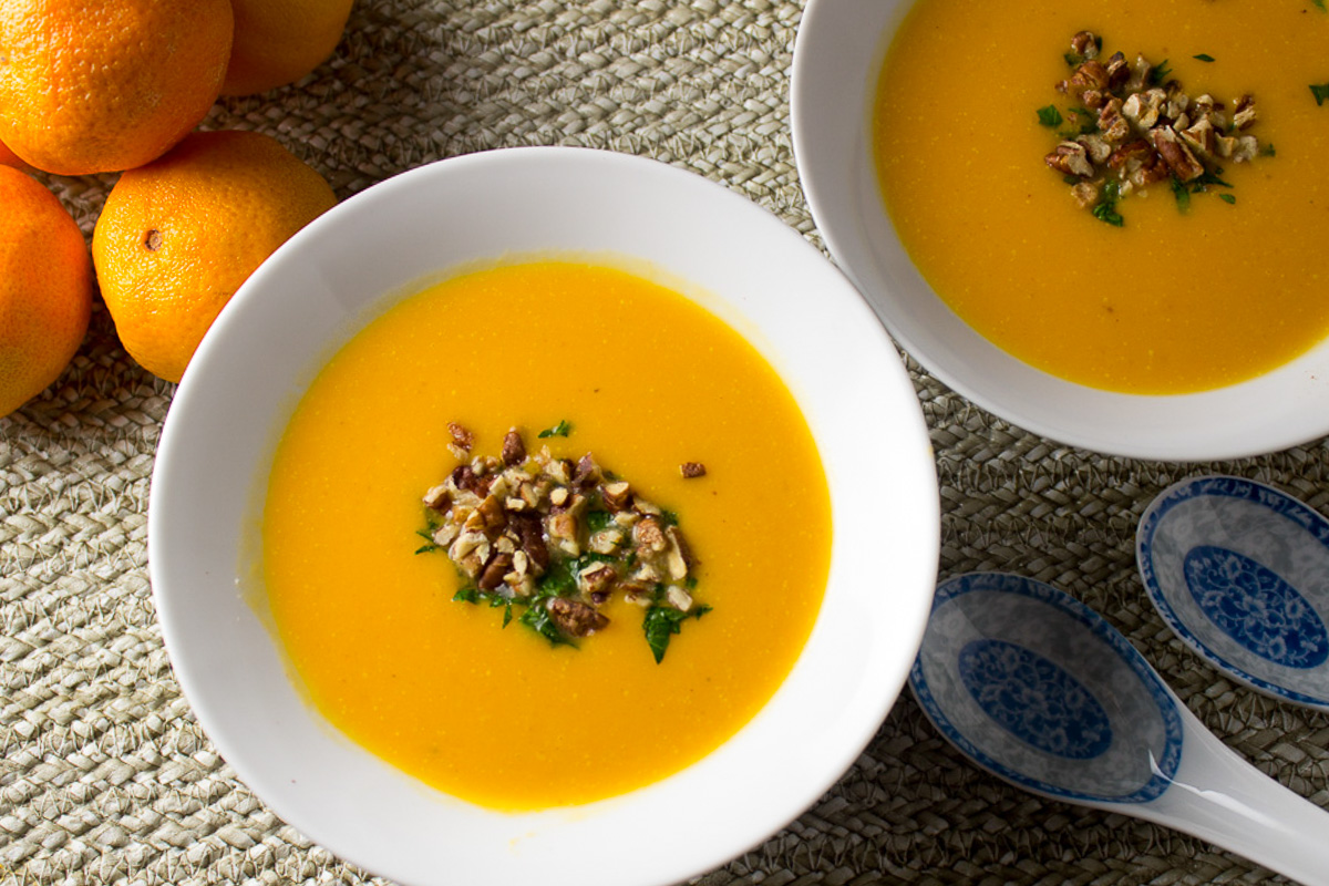 two bowls of sweet potato squash soup with crouton garnish