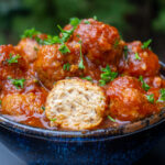 bowl of sweet and sour meatballs on table