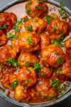 bowl of meatballs in sweet and sour sauce.