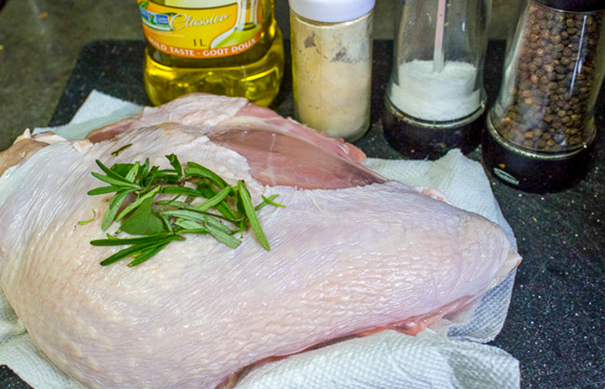 half raw turkey breast oil, garlic powder, salt, pepper, fresh rosemary.,