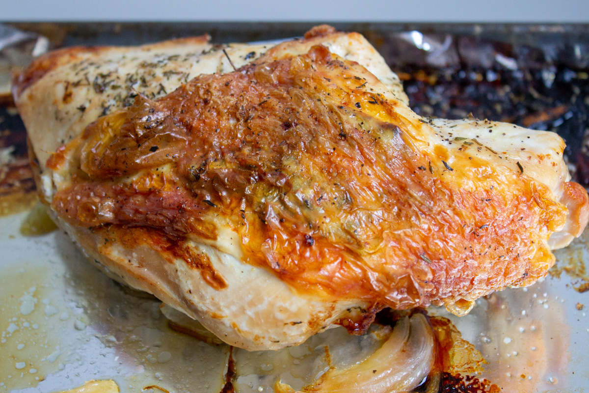 roasted half turkey breast on foiled pan.